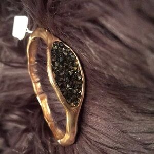 Crushed black crystals in gold bracelet